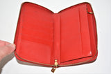 Louis Vuitton, Portefeuille compact " Eldrich ", en cuir verni rouge