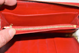 Louis Vuitton, Portefeuille compact " Eldrich ", en cuir verni rouge