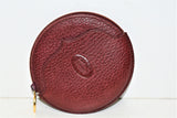Cartier, porte-monnaie rond en cuir grainé bordeaux, vintage