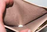 Louis Vuitton, Porte-monnaie VIENNOIS, en cuir verni beige